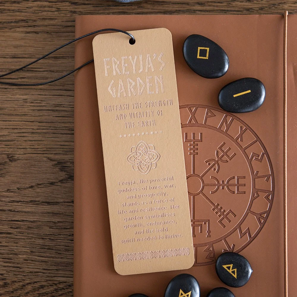 Wooden bookmark with engraved flower symbol and Viking words from Freyja's Garden, inspired by mythology and epic tales