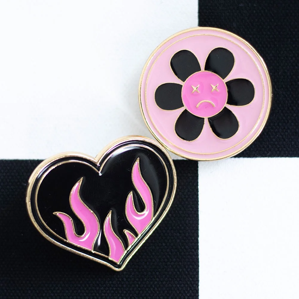Burning heart pin badge and sad flower pin badge set with bold Y2K style on white background