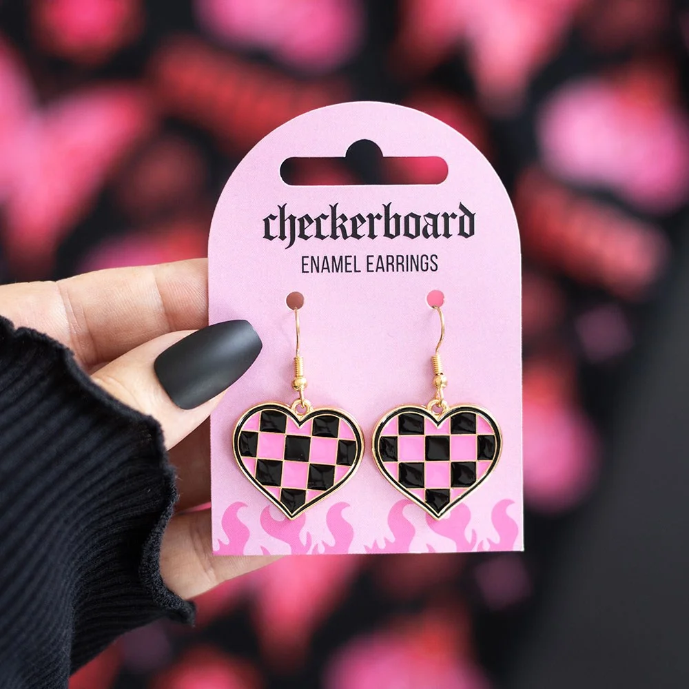 Pink and black checkerboard heart earrings made from alloy, shown on a white background