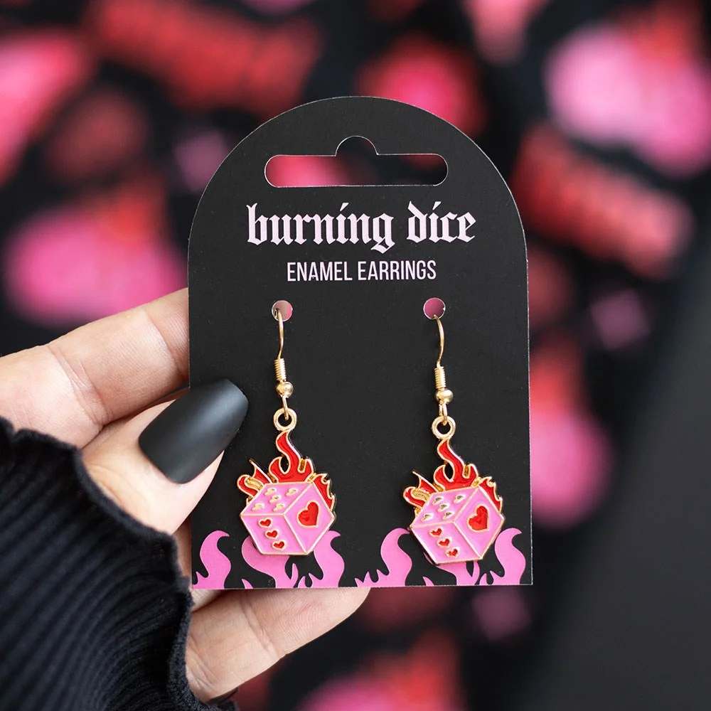 Pair of burning dice earrings in fiery pink and red, made from alloy, styled for alternative fashion looks