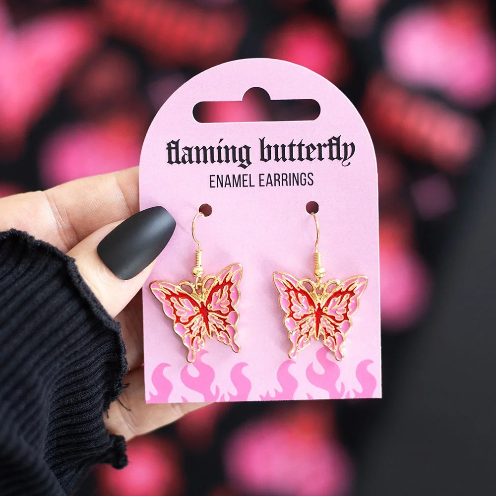 Pink and red cybersigil butterfly earrings with a flaming design, made from alloy, ideal for Y2K style fans