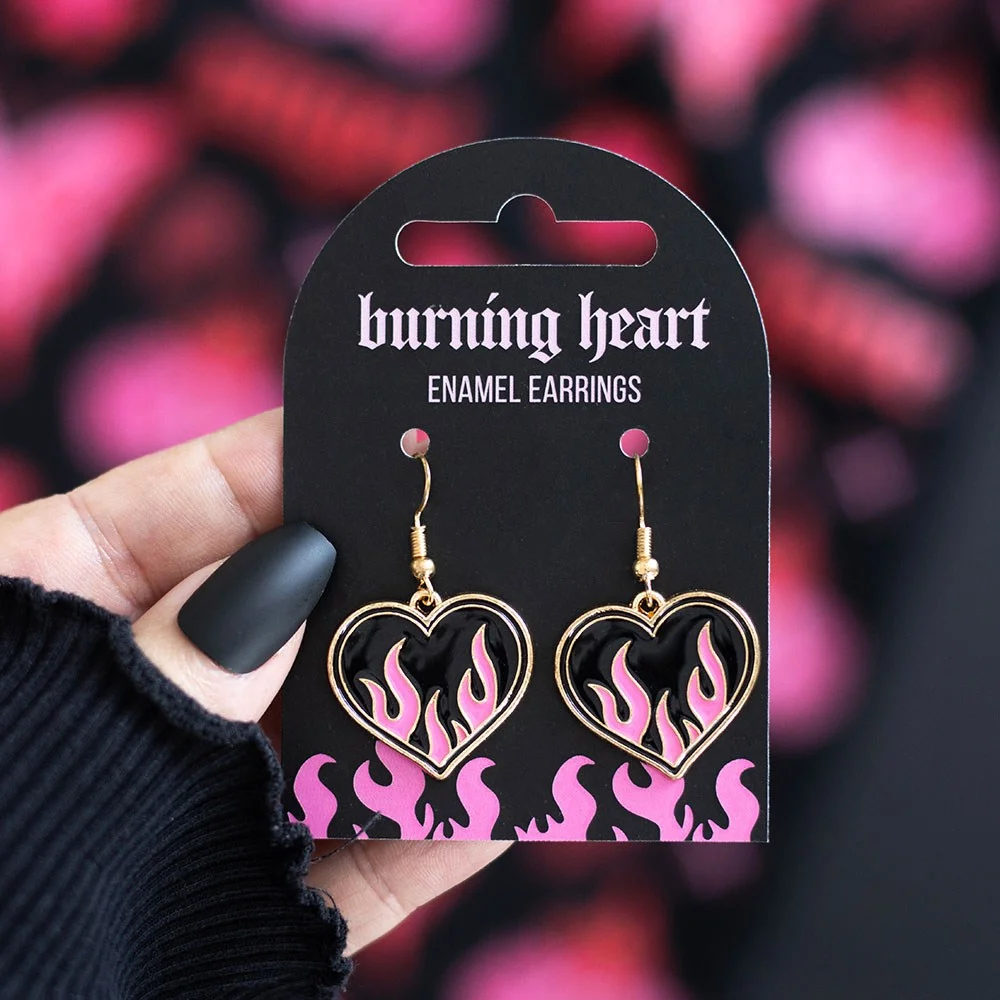 Pink and black flame burning heart earrings made from alloy, designed in Y2K style for rebellious looks