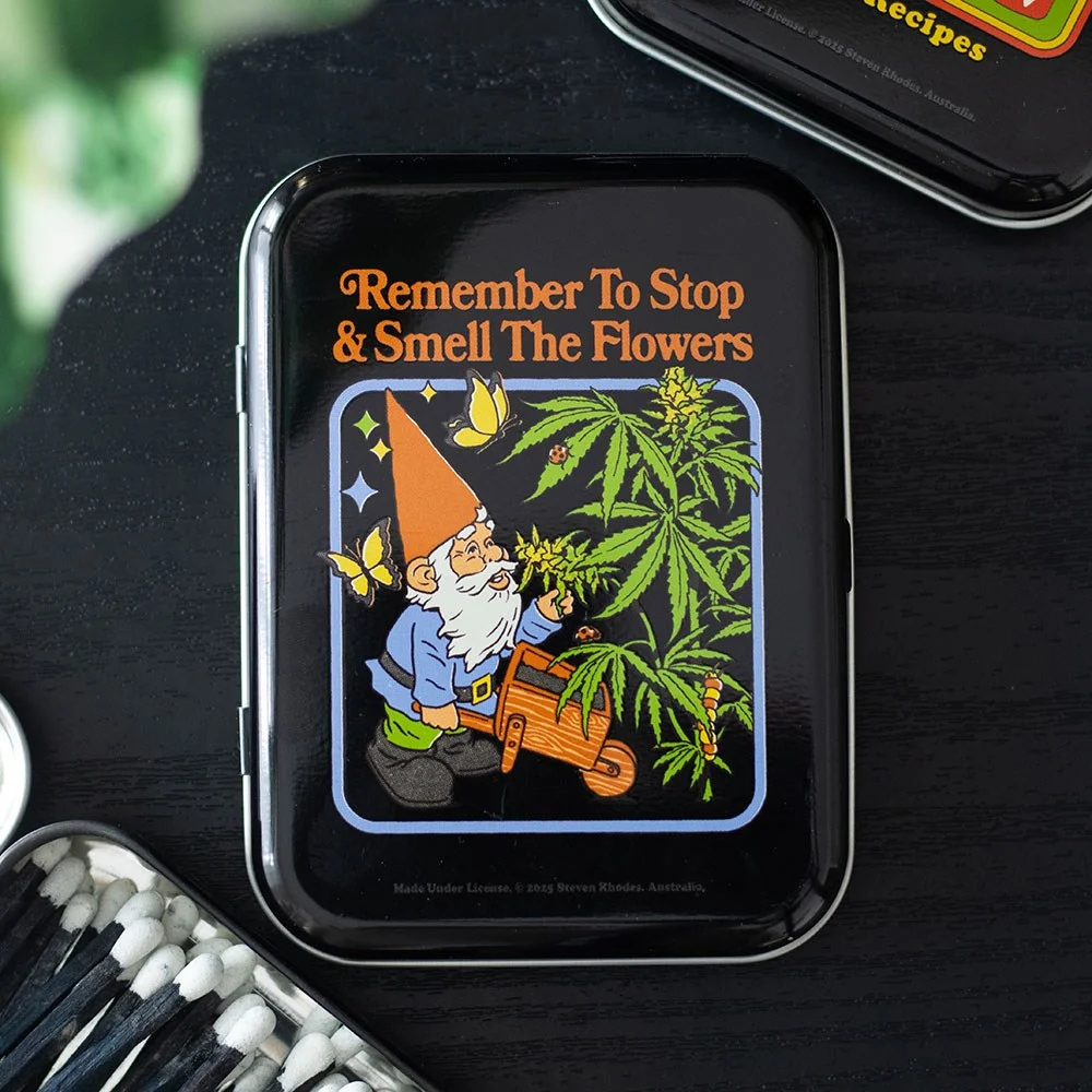 Rectangular herbal stash tin with a gnome illustration and "Smell the Flowers" text by Steven Rhodes