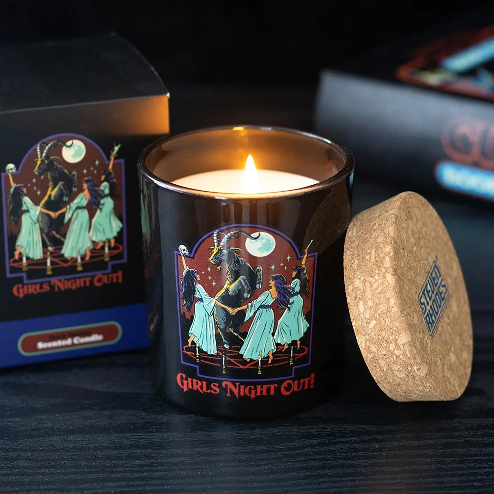Girls Night Out Dark Opium scented candle by Steven Rhodes with goat and pentagram design on glass jar