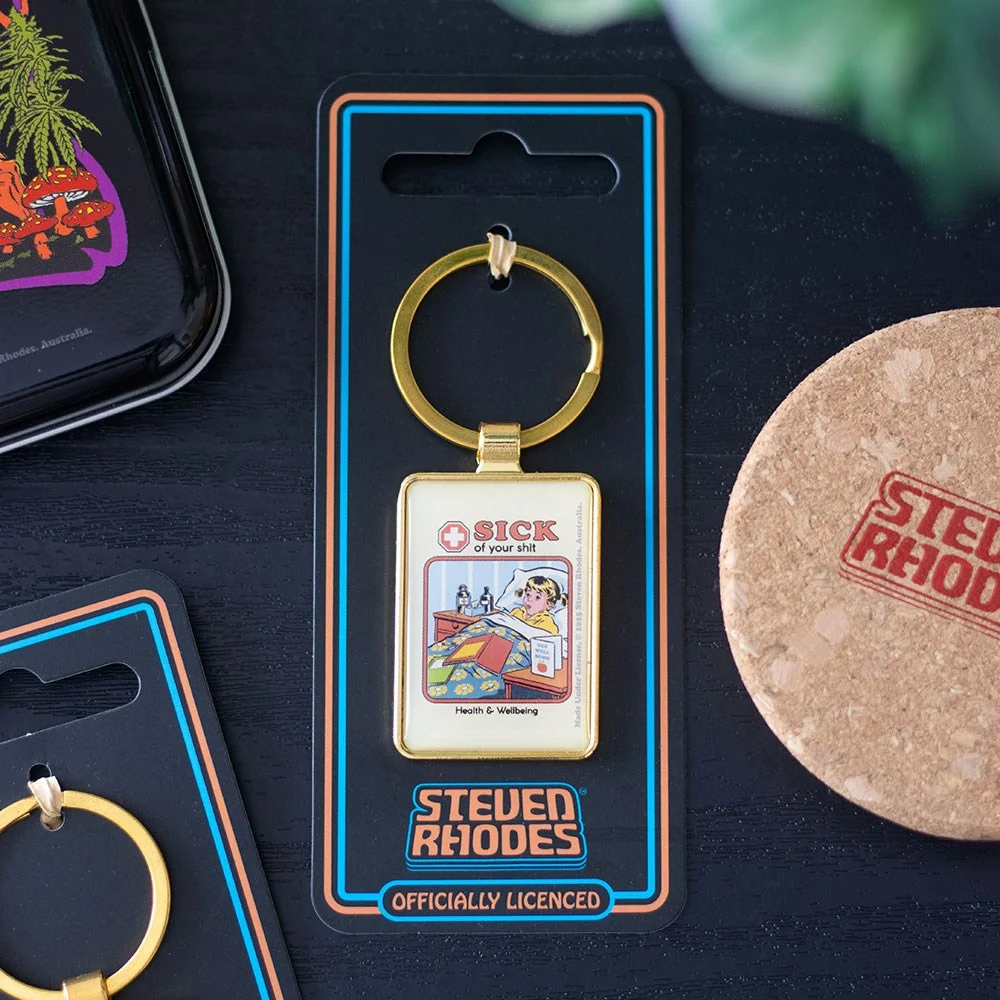 Sarcastic enamel keyring with "Sick of Your Shit" text in retro style, attached to a keyring with metal clip