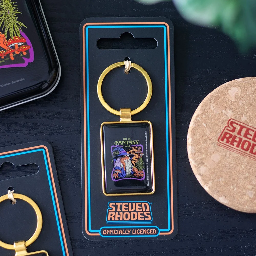 Steven Rhodes keyring featuring a colorful enamel design with mushrooms and magical fantasy elements on a metal ring