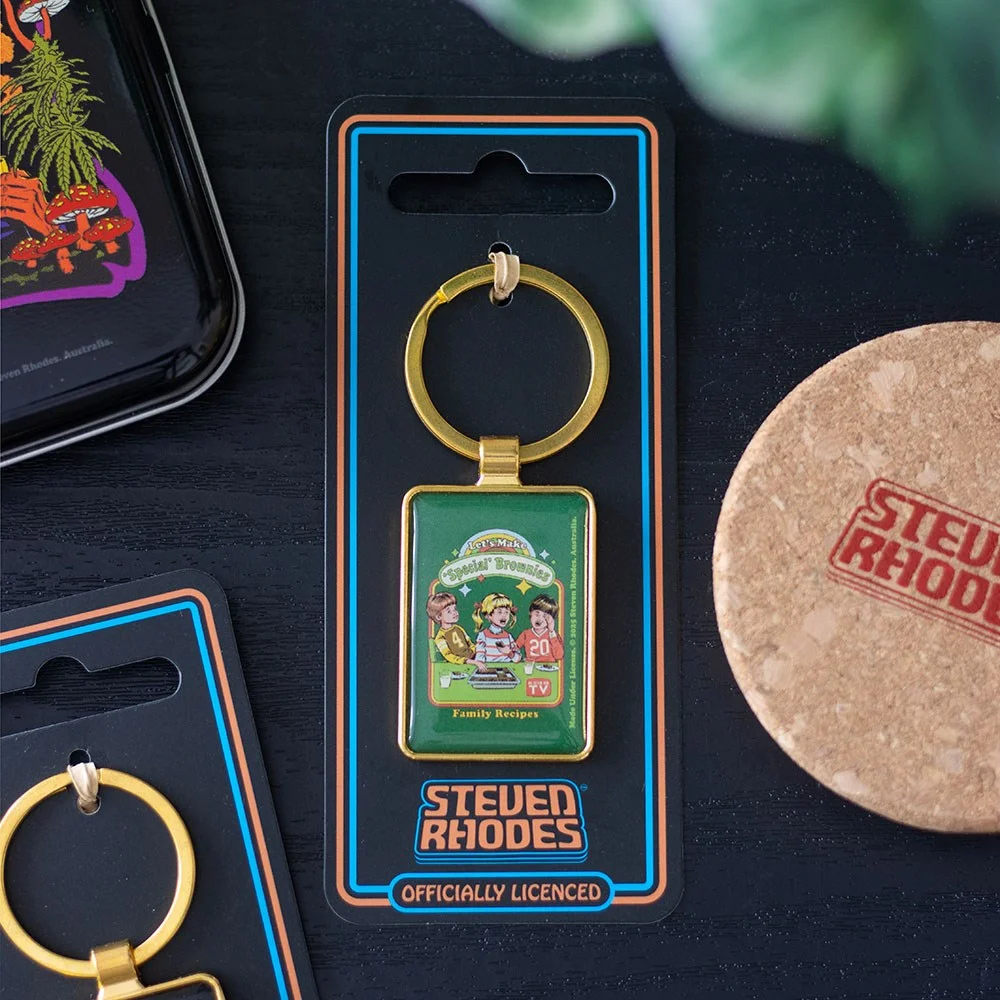 Novelty enamel keyring featuring retro baking scene with brownies and special ingredients from Steven Rhodes collection