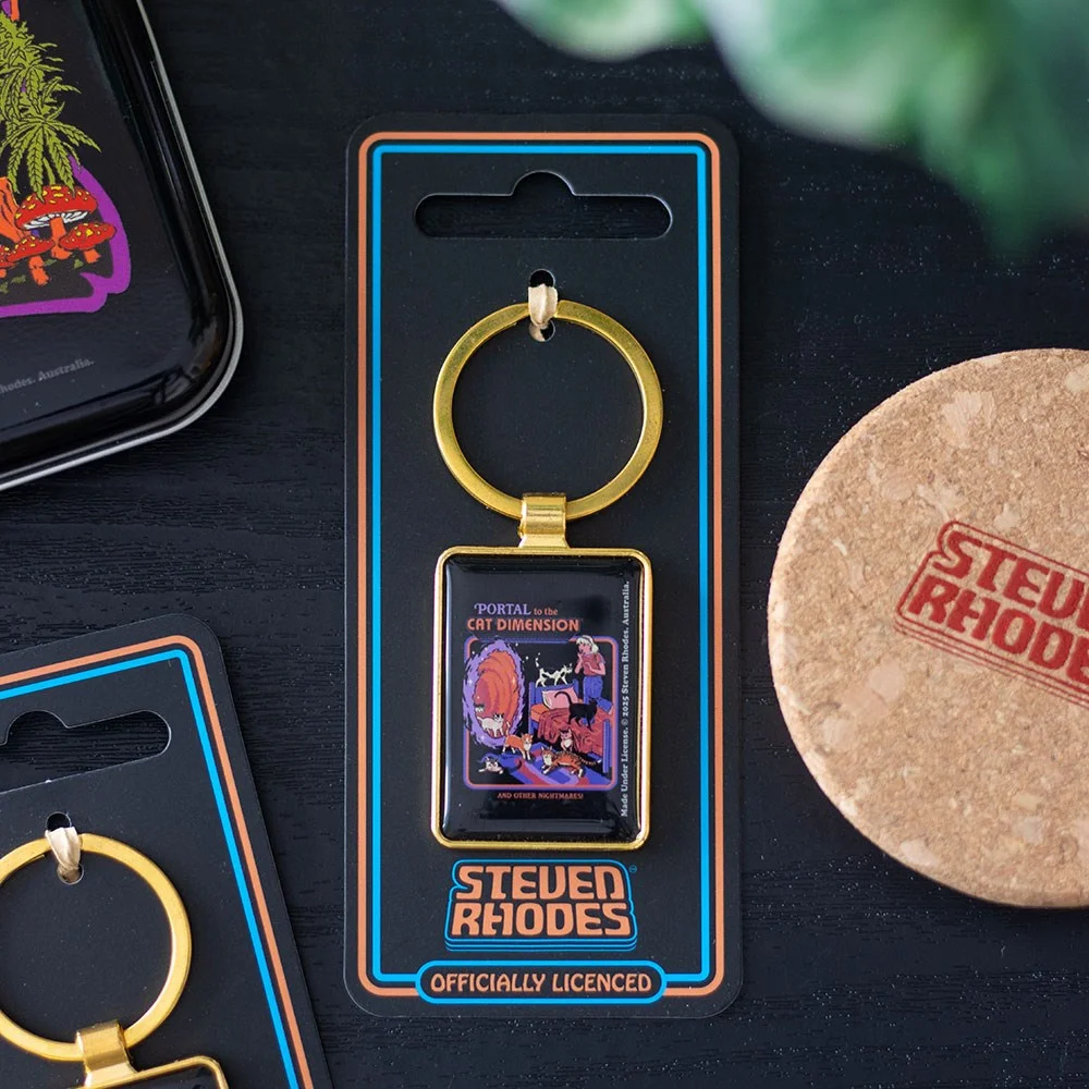 Retro-style enamel keyring showing a bedroom portal with cats, part of Steven Rhodes cat enamel keyring collection