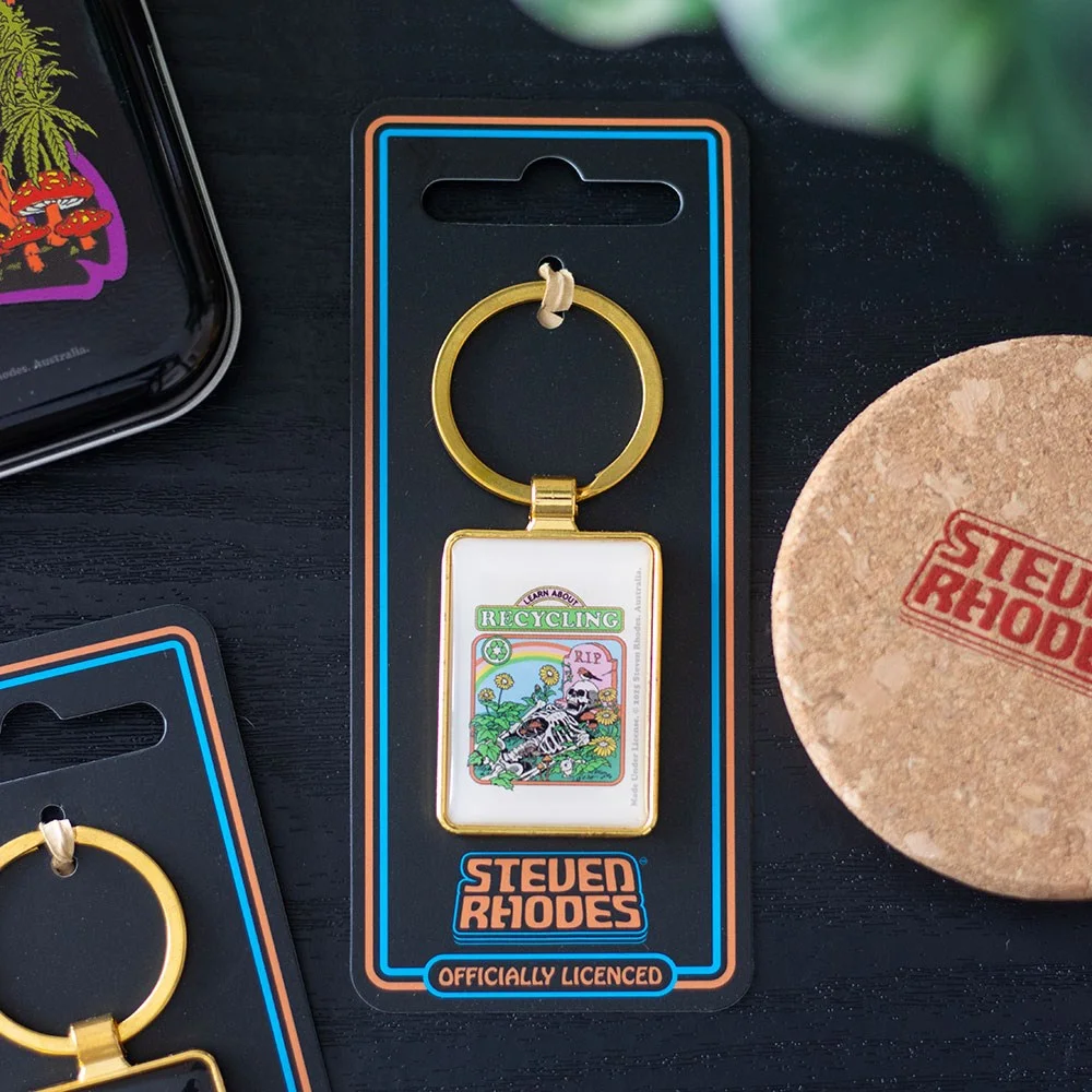 Enamel eco-friendly keyring with skeleton, sunflowers, and gravestone from Steven Rhodes collection