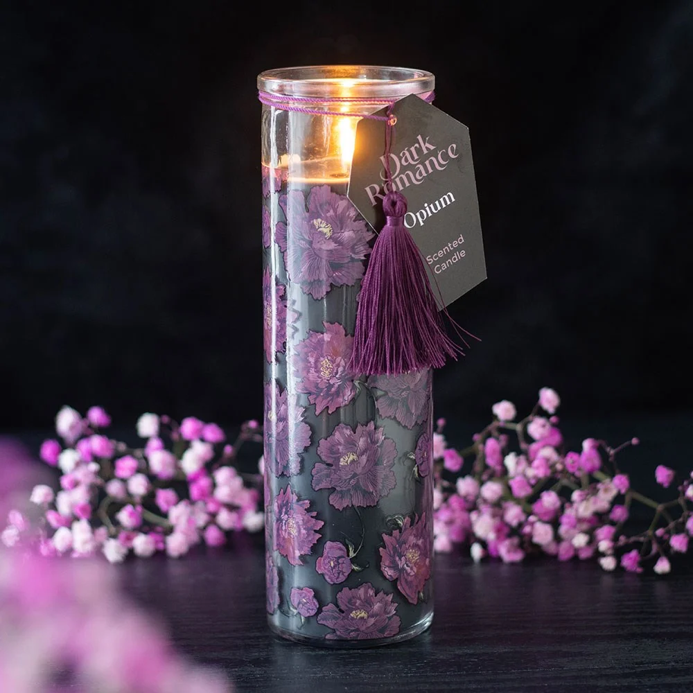 Dark Romance opium scented candle in a sleek black tube with gold lettering, ideal for long burn and rich scent experience