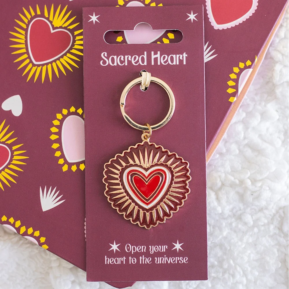 Sacred heart keyring with radiant red heart and shimmering gold accents on a silver keyring loop