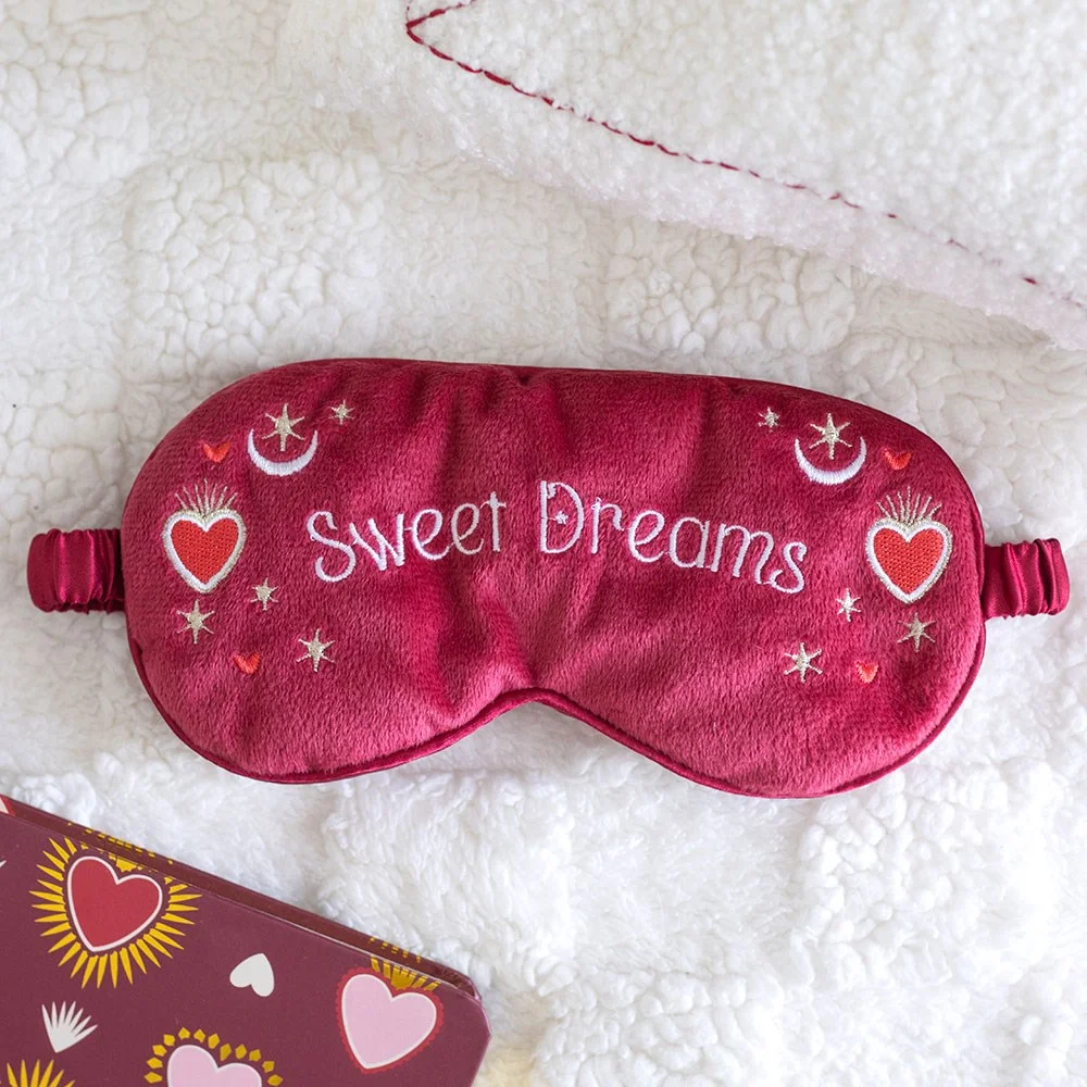 Red velvet sleep mask with Sweet Dreams text and heart and moon designs for restful nights and relaxation