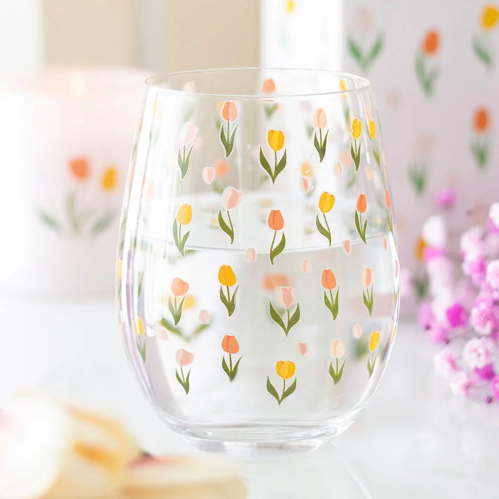 Clear stemless tulip glass with colourful printed tulip flowers, 450ml capacity, ideal for spring and garden parties