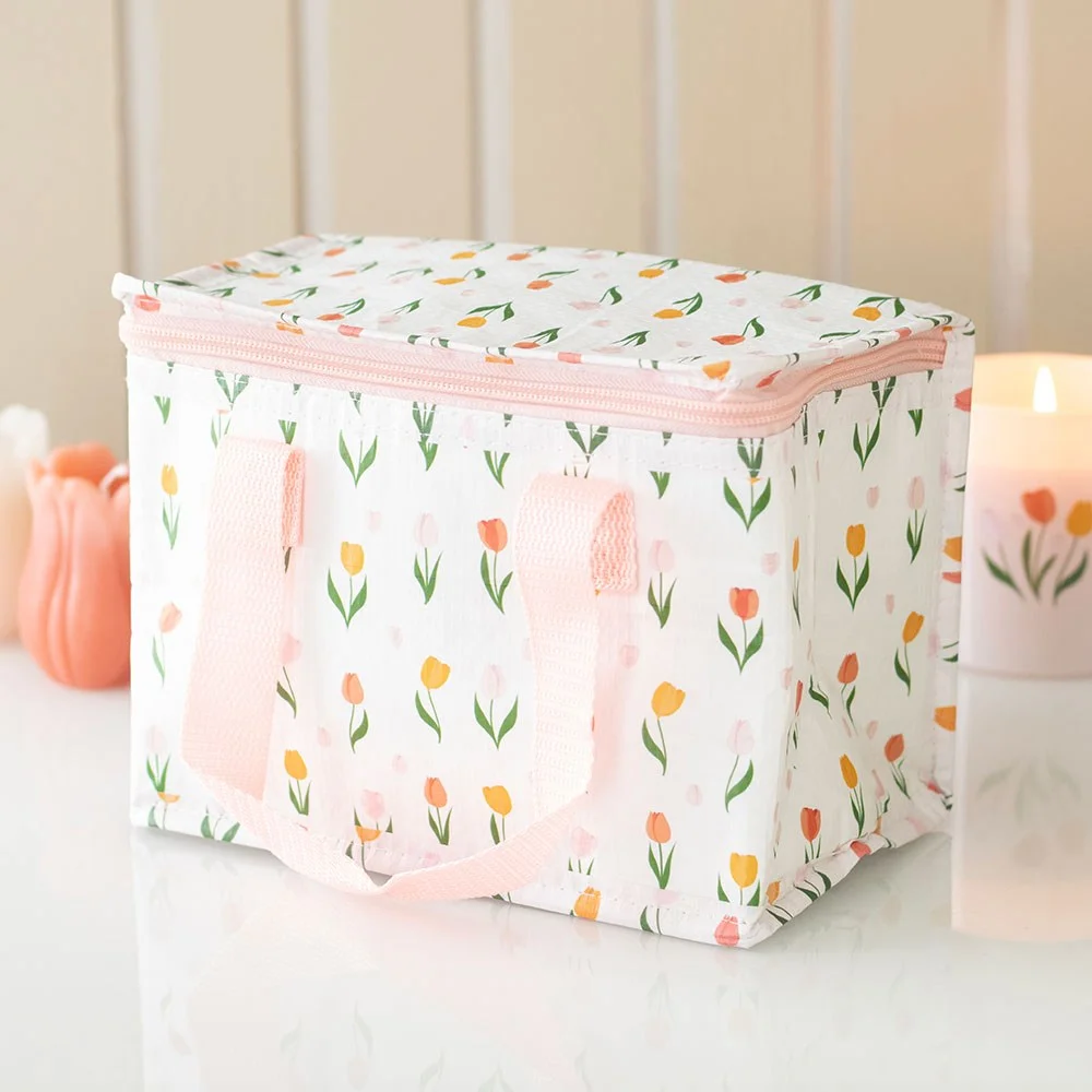 Tulip print recycled plastic lunch bag with pink and green floral design on white background, rectangular shape with handle
