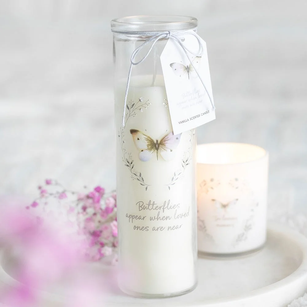 Vanilla scented candle in a white tube with butterfly design and message "Butterflies appear when loved ones are near