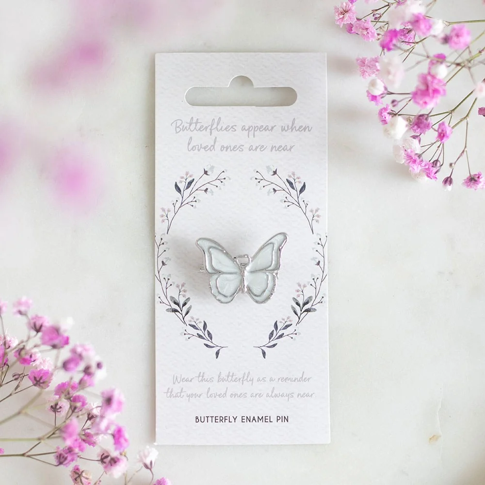 Enamel butterfly pin on a display card with the words "Butterflies appear when loved ones are near