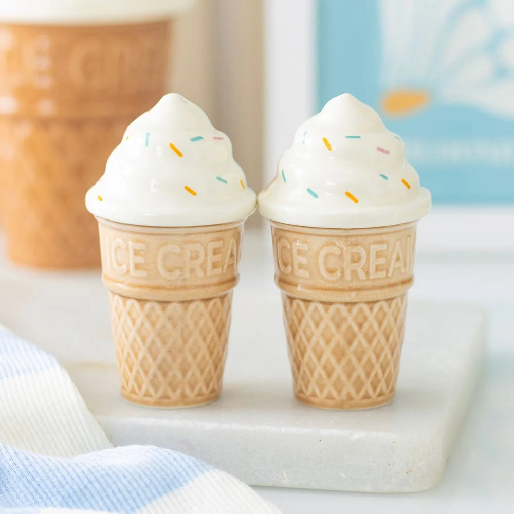 Ceramic ice cream salt and pepper shakers shaped like realistic ice cream cones on a white background