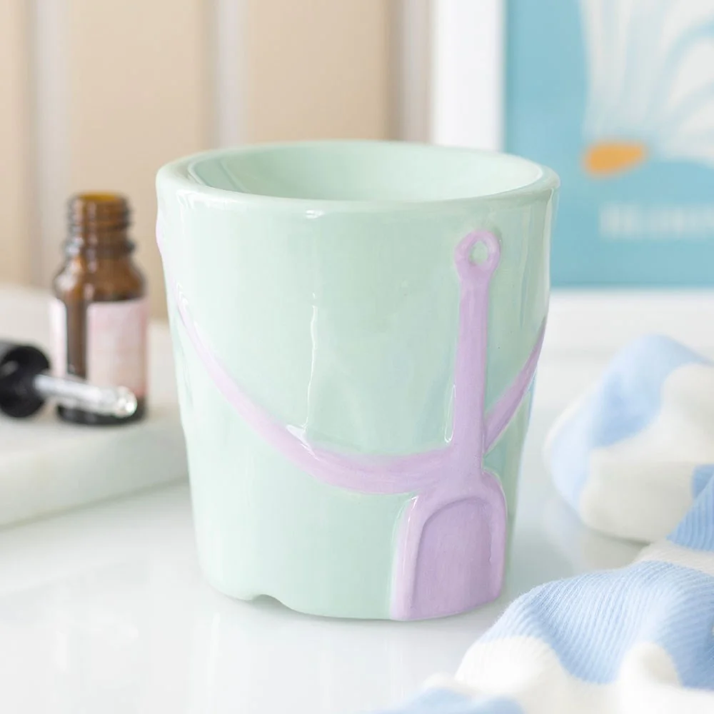 Pastel bucket and spade ceramic oil burner designed for use with diluted fragrance oil and tealight candle