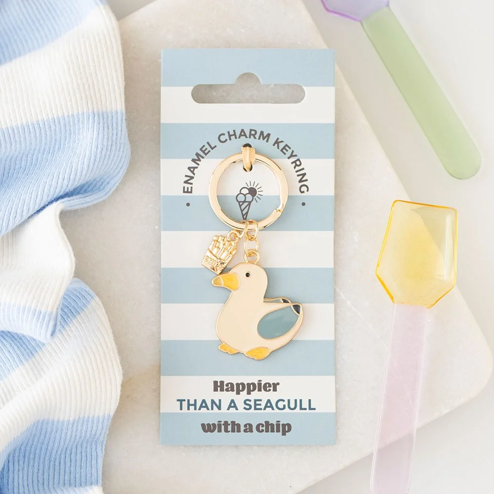 Blue enamel seaside keyring featuring a flying seagull and chips design on lightweight alloy material