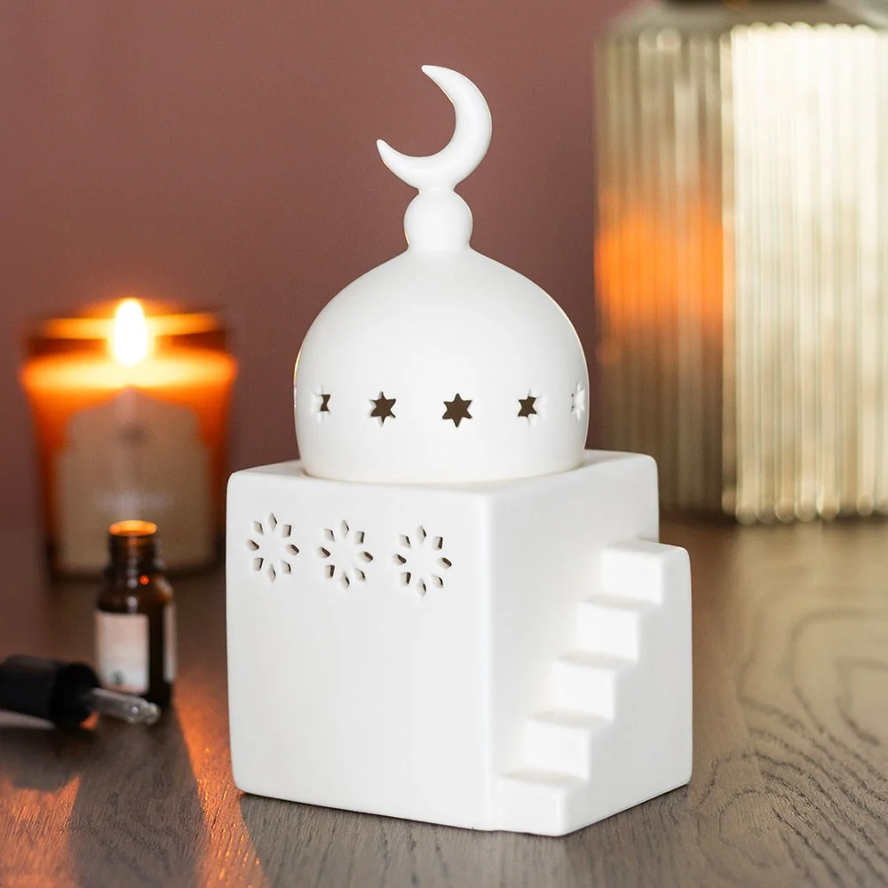 Ceramic mosque shaped burner with intricate cut-out details, designed for tealights and fragrance oils