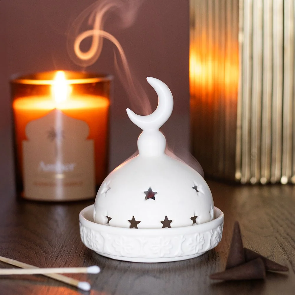 Ceramic mosque incense holder with intricate mosque design, holding a lit tealight and incense cone on a white background
