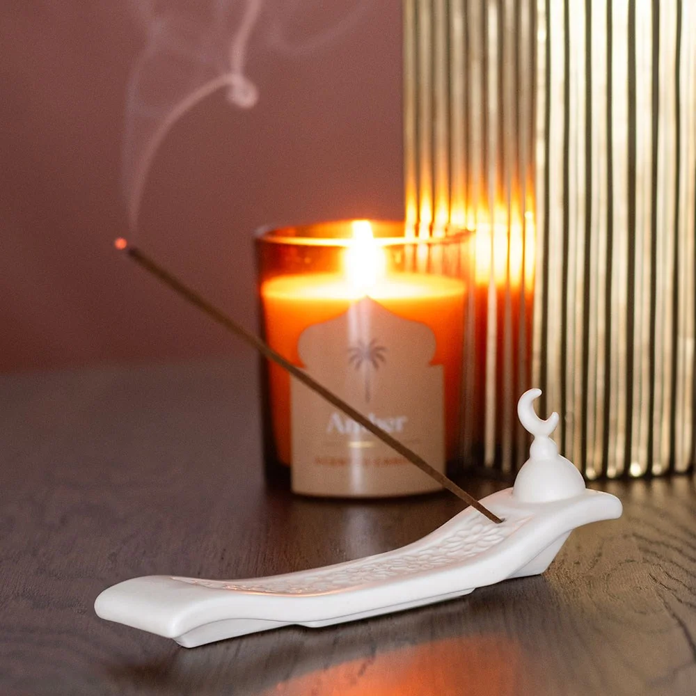 Cream ceramic crescent moon incense holder with geometric pattern, designed as an ash catcher for incense sticks