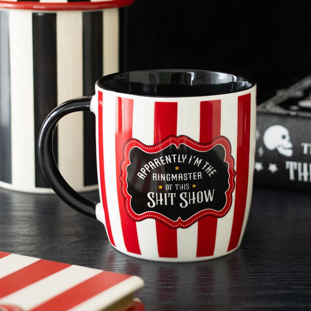 Red striped ringmaster mug with circus stripes and a bold message: 'Apparently I’m the ringmaster of this shit show'.