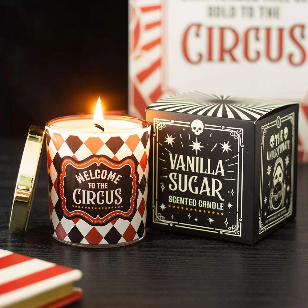 Vanilla sugar candle with Circus welcome label and harlequin pattern.