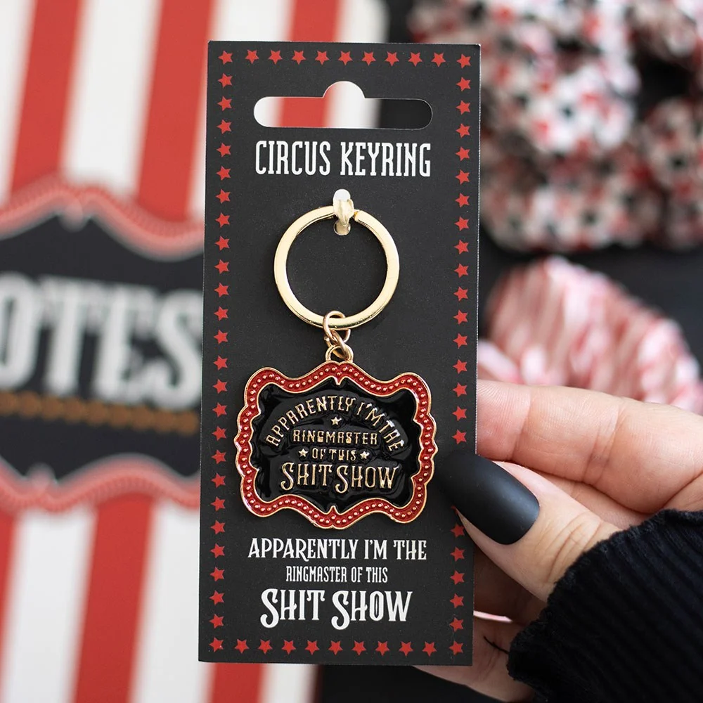 Vintage-style enamel circus ringmaster keyring featuring a bold, unapologetic design.