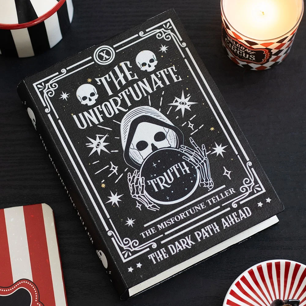 Book storage box shaped like a spellbook with a fortune teller and ominous warnings on the lid, holding tarot cards and treasures.