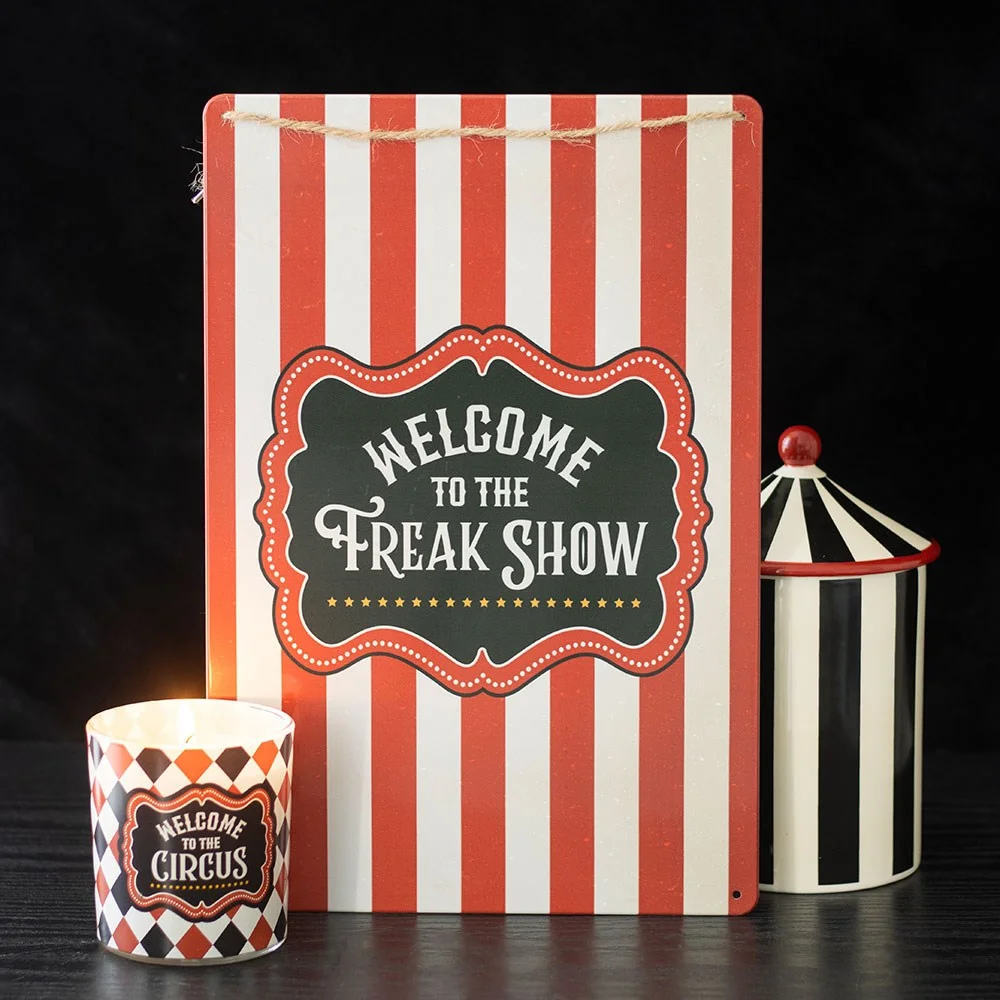 Metal freak show wall sign with bold circus stripes and Welcome to the Freak Show text.