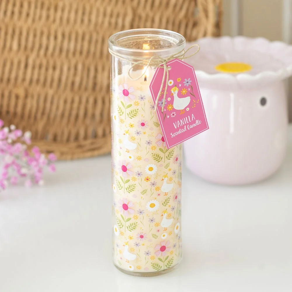 Tall glass tube vanilla scented candle with colorful Daisy & Duck print, ideal for home decor or gifting