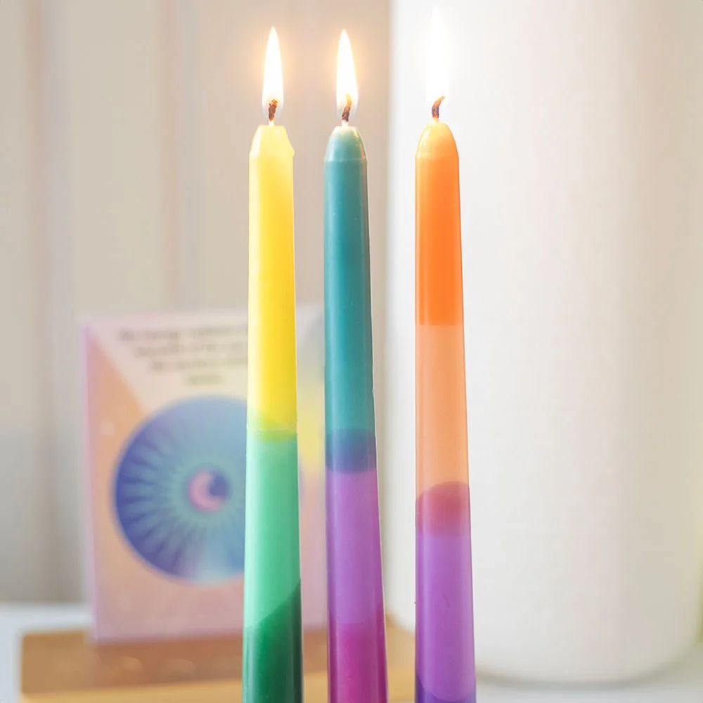 Set of 3 vibrant dipped taper candles in bright colors, ideal for rituals or meditation, unscented paraffin wax, 3-hour burn time