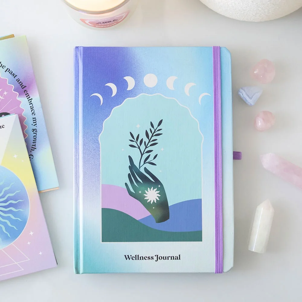 Aura Energy wellness journal A5 with iridescent edges, calming artwork cover, elastic closure, and matching crystal chip pen