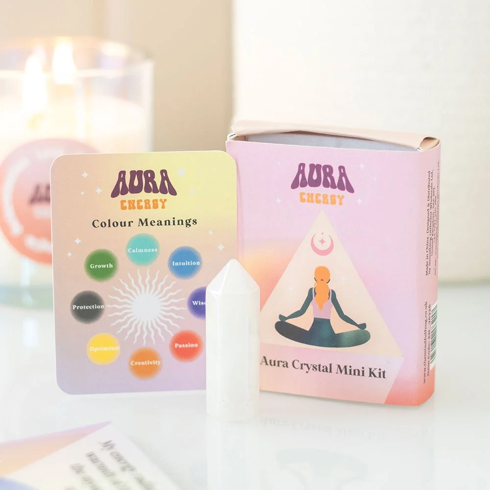 Polished crystal point with colourful aura reading guide cards in an aura reading crystal kit for spiritual energy tuning