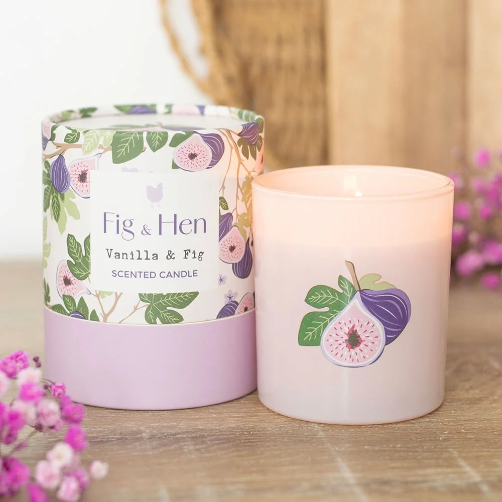 Soft pink glass jar with fig illustration holding a vanilla fig scented candle for 28-hour burn time