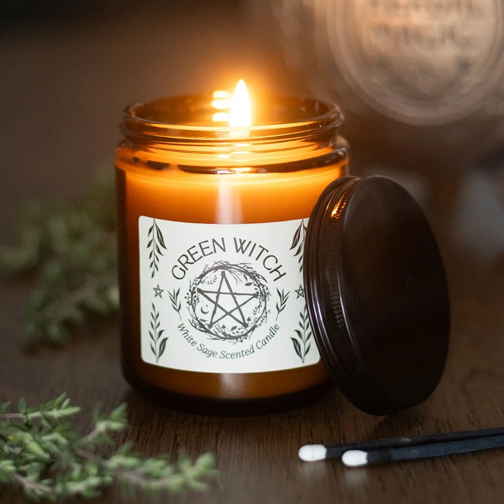 Amber glass white sage candle in a clear glass holder, paraffin wax, 22‑hour burn