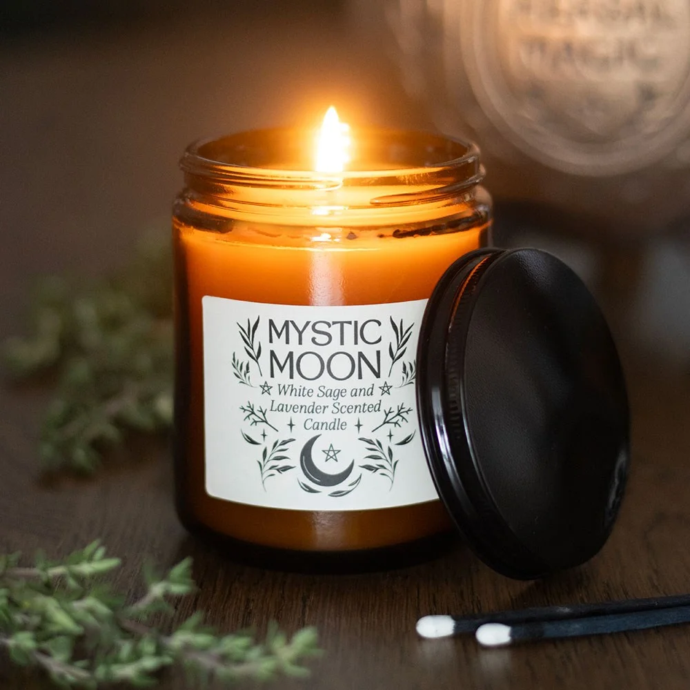 Amber glass sage lavender candle with a soft glow, paraffin wax and a clean white base, ideal for calming rituals.