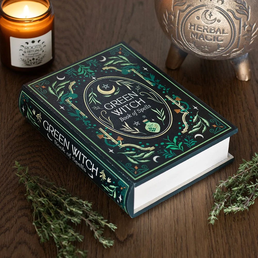 Green Witch book shaped storage box styled like a mystical grimoire with green cover and gold detailing, open to show interior compartment
