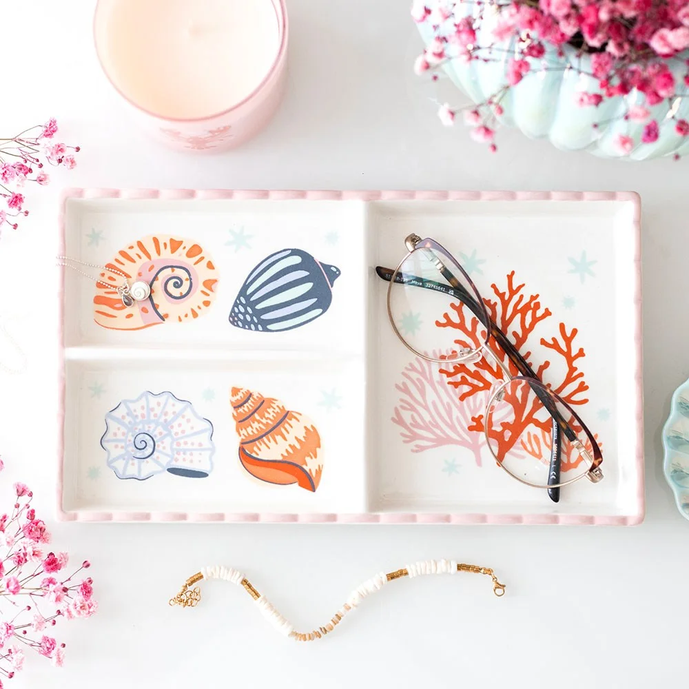 Ceramic trinket tray with pastel shells and coral design, featuring three sections for jewellery or small items