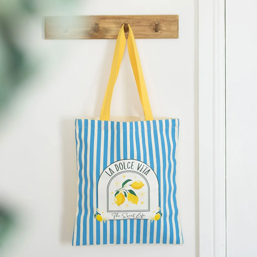 Polycotton tote bag with nautical blue stripes and La Dolce Vita text, ideal for beach or market use