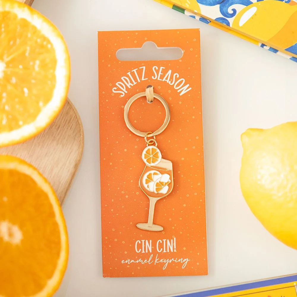 Colourful enamel spritz season keyring featuring a summer cocktail design for aperitivo hour lovers