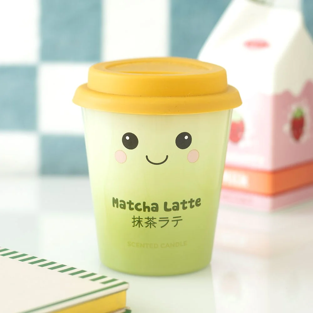 Matcha latte scented candle shaped like a takeaway cup with a kawaii face, soft green gradient, small paraffin wax candle