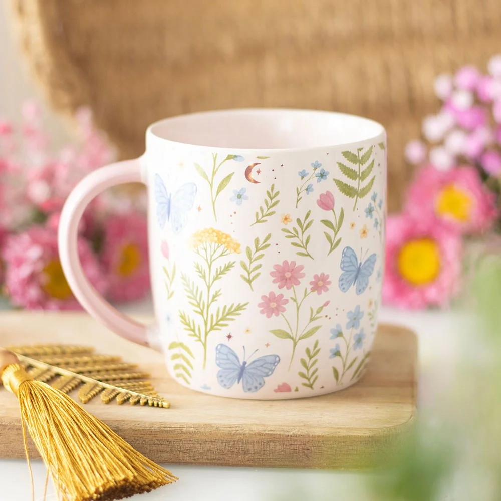 Ceramic floral print mug with delicate pastel flowers, 370ml capacity, microwave and dishwasher safe, on white background