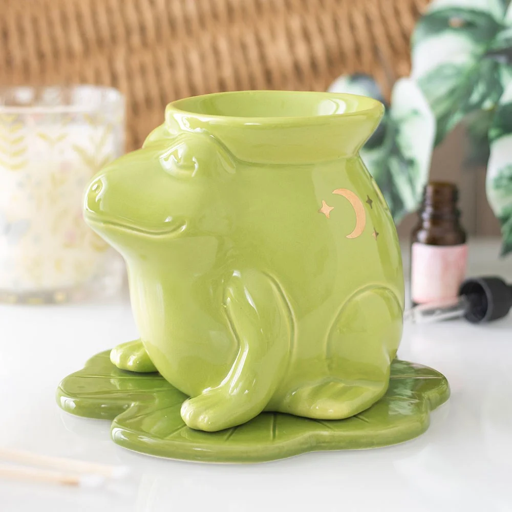 Ceramic oil burner shaped like a whimsical frog with a tealight holder at the back for home fragrance use