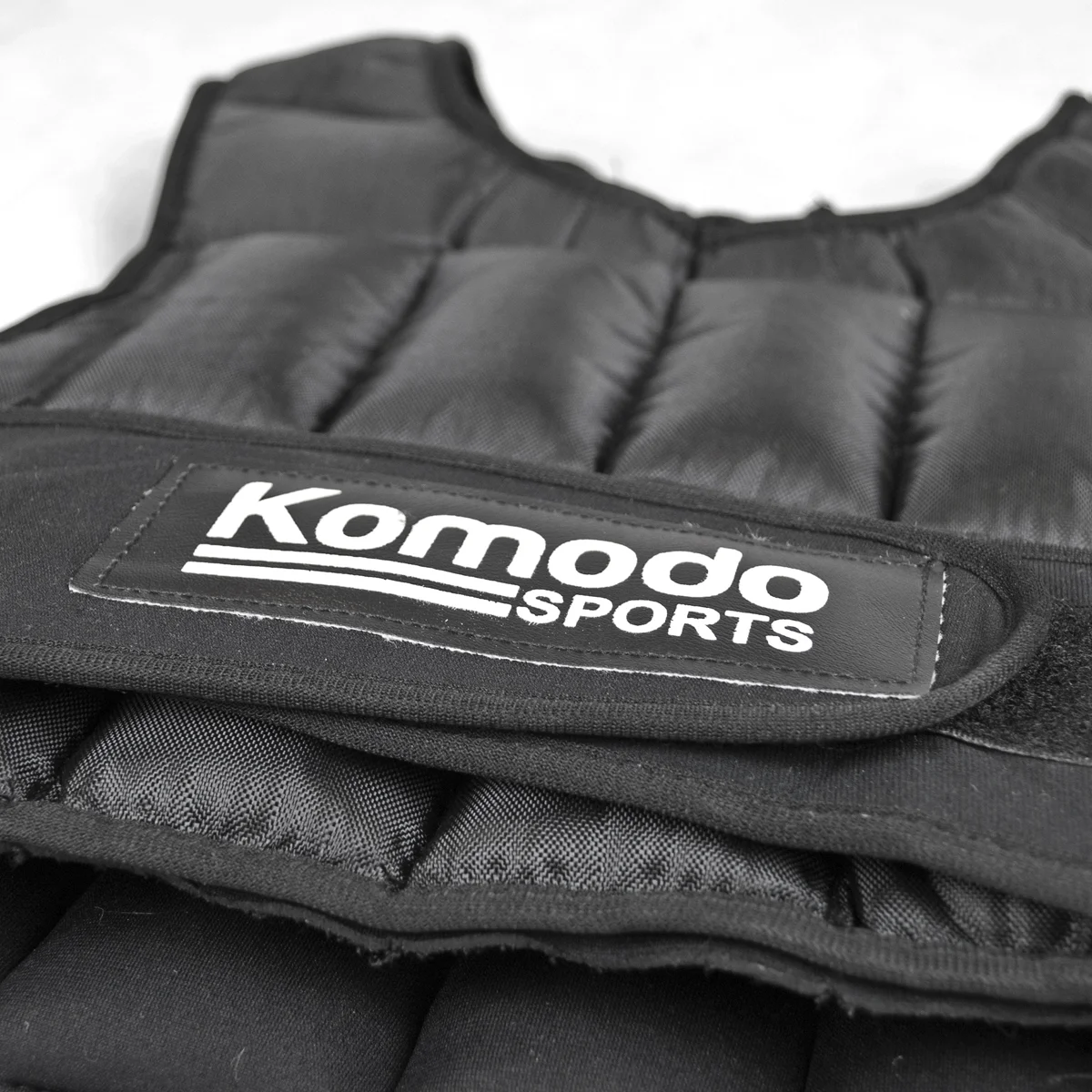 Black Komodo 20kg intense training vest with adjustable weights, designed for strength and cardio workouts