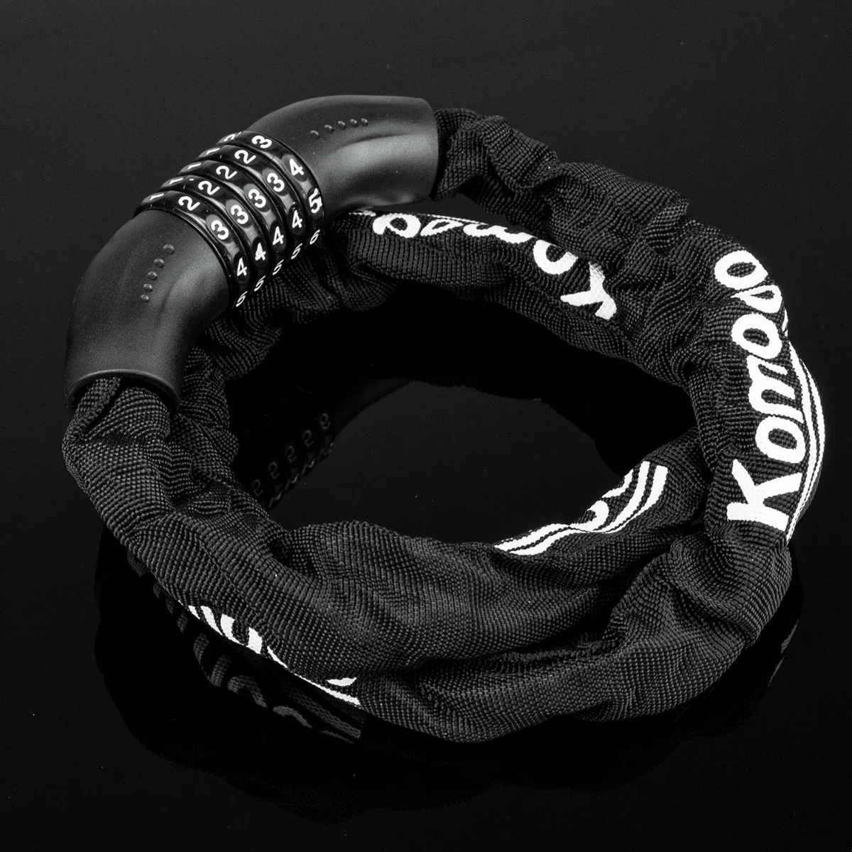 Close-up of a resettable bike lock showing the 5 digit combination on a heavy duty steel chain with fabric cover