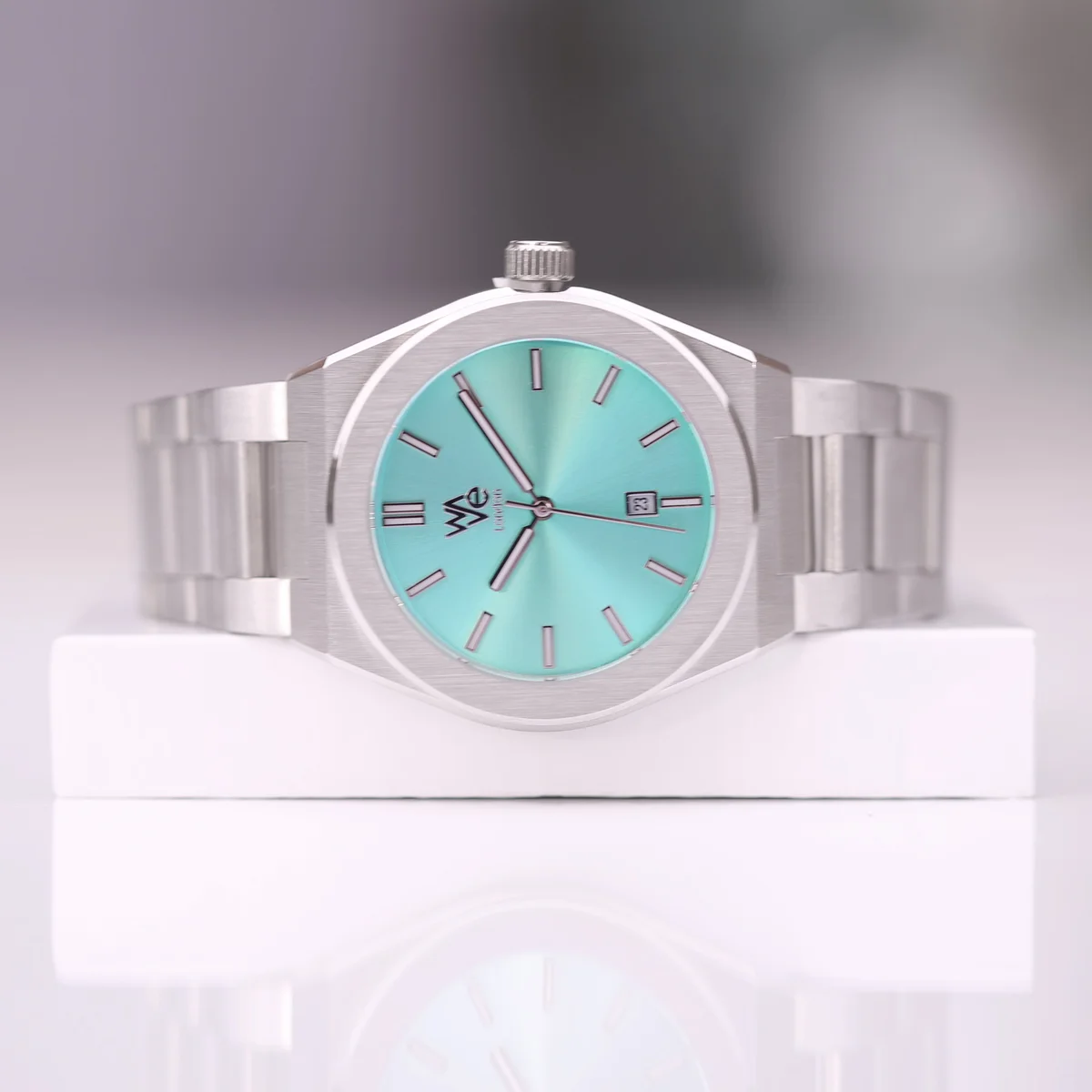Ocean blue watch by Architect with stainless steel band and minimalist dial, engraved with custom handwriting on back