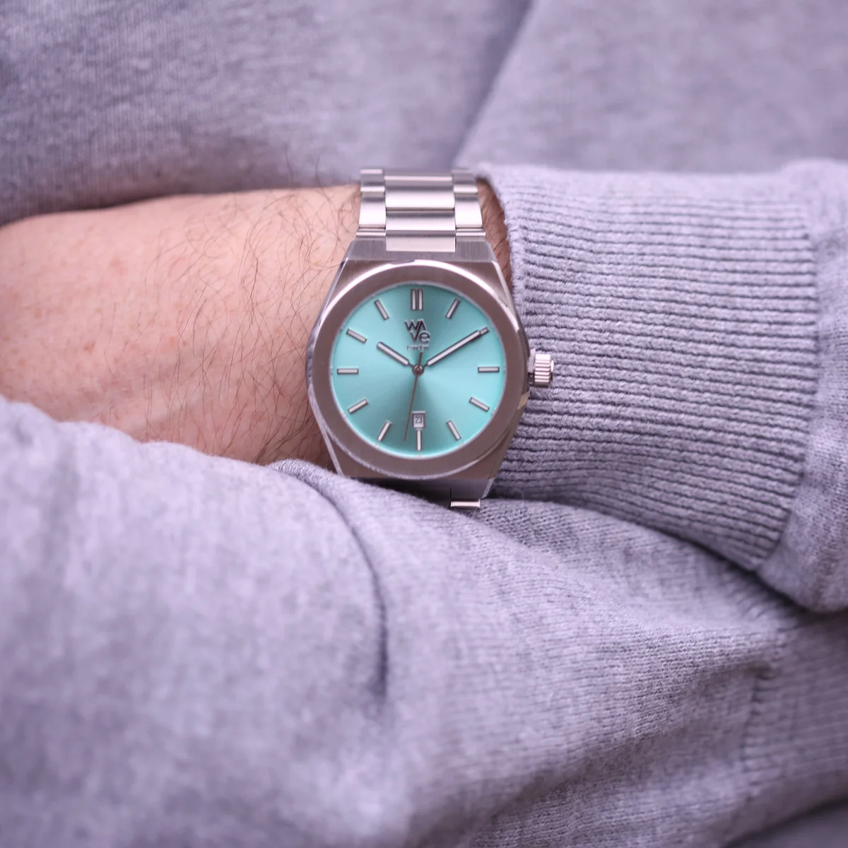 Ocean Blue Wave by Architect stainless steel watch with minimalist dial and engraved stainless steel band on white background