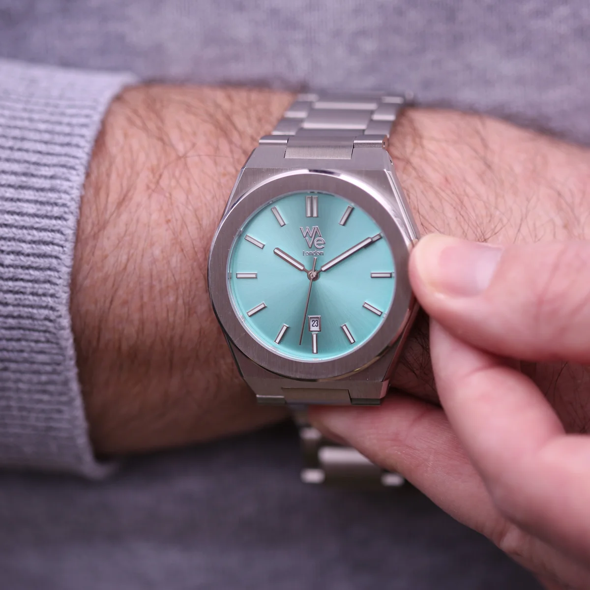 Ocean Blue Wave by Architect water resistant watch with luminous dial and stainless steel band on white background